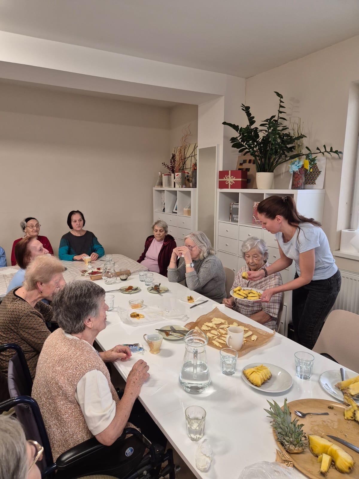 Olga leading a nutrition workshop with elderly residents